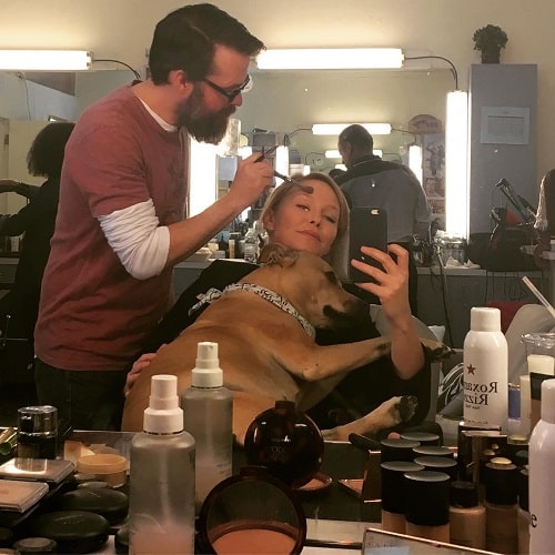 A picture of Kelli Giddish with her dog.